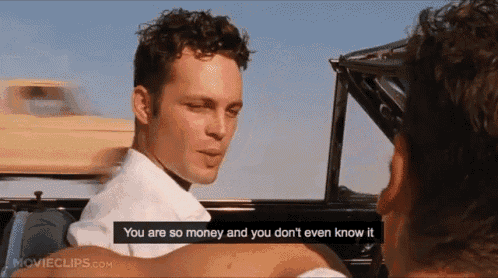 two men are sitting in a car and one of them says " you are so money and you don t even know it "
