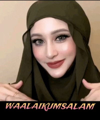 a woman wearing a green hijab with the words waalaikumsalam written below her