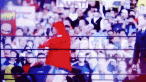 a blurry picture of a boxing ring with a sign that says ' nbc sports ' on it
