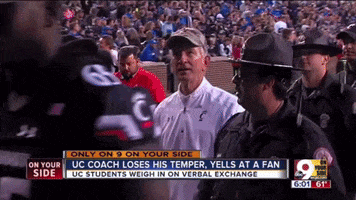 uc coach loses his temper and yells at a fan on a news channel