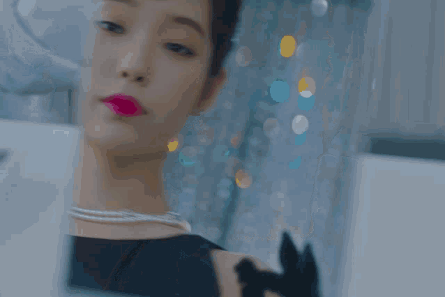 a close up of a woman 's face with the word sony on the bottom right
