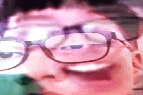 a close up of a person wearing glasses with a purple background