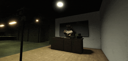 a dark room with a desk and a picture on the wall that says " exit "