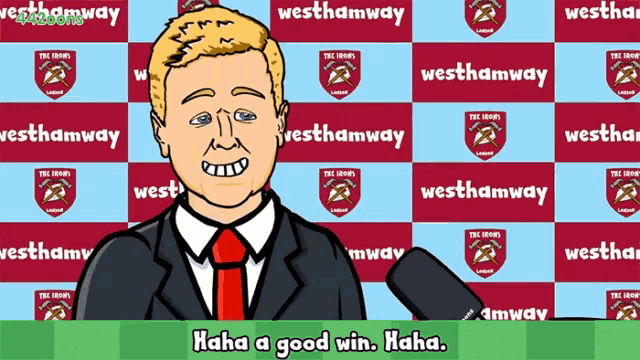 a man in a suit and tie is holding a microphone in front of a backdrop that says westhamway