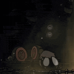a cartoon character is laying on the ground in a dark room