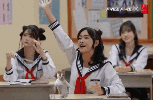 a girl raising her hand in a classroom with a free fire x logo on the wall