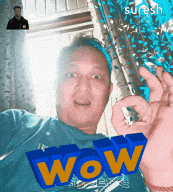 a man in a blue shirt with the word wow on his shirt