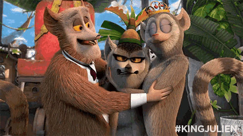 a group of monkeys hugging each other with the hashtag #kingjulien