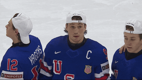a hockey player with the number 12 on his jersey