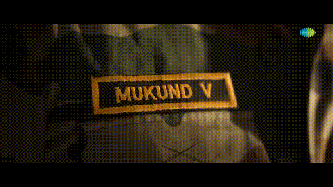 a patch on a person 's jacket that says mukund v