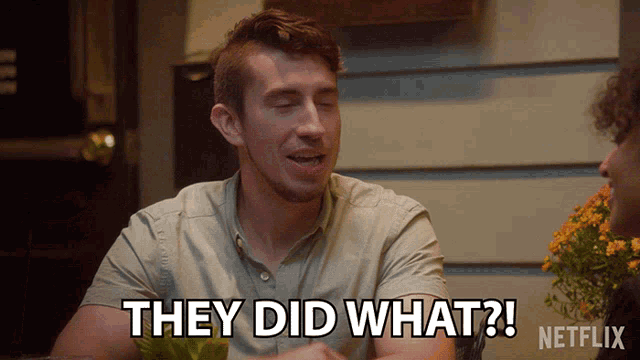 a man is sitting at a table and says they did what