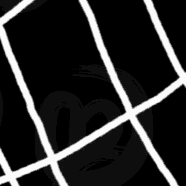 a black and white image of a volleyball net with a mickey mouse face behind it .