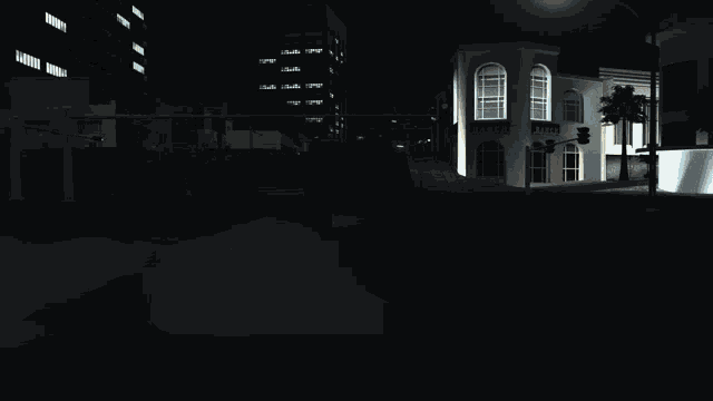 a dark city street with a building that says ' abercrombie & fitch ' on the front