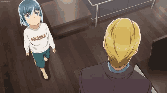 a little girl wearing a shirt that says rokosuka stands next to a man