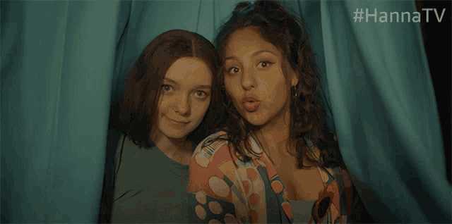 two girls are posing for a picture in a photo booth with the hashtag #hannatv