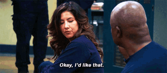 a woman is sitting next to a man and says okay , i 'd like that .