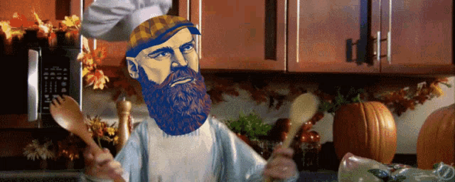 a man with a beard wearing a chef 's hat and apron is cooking