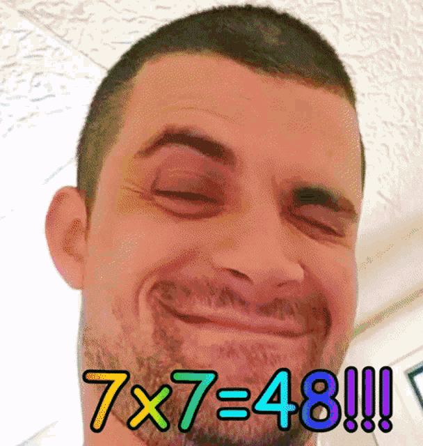 a man with a beard is making a funny face with 7x7 = 48 written above him