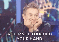 a man is sitting in a chair with his hands on his chin and a caption that says `` after she touched your hand '' .