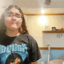 a woman wearing glasses and a t-shirt that says ' squirrel ' on it
