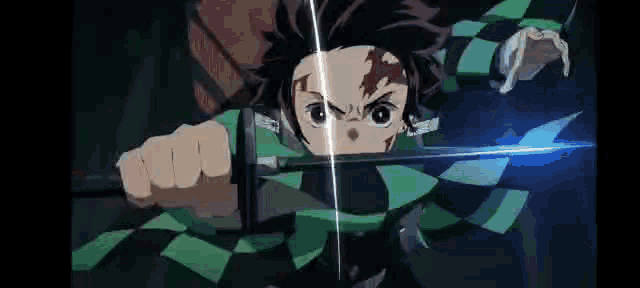 a person is holding a sword in their hand in a dark room .