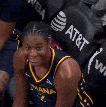 a female basketball player wearing a jersey that says indiana on it