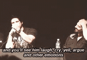 a man is singing into a microphone with the words and you 'll see him laugh cry yell argue and other emotions