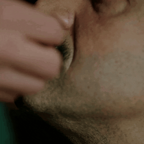 a close up of a man 's face with duct tape on it