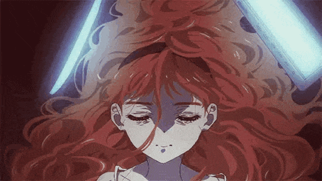 a close up of a girl with red hair and a blue light behind her .