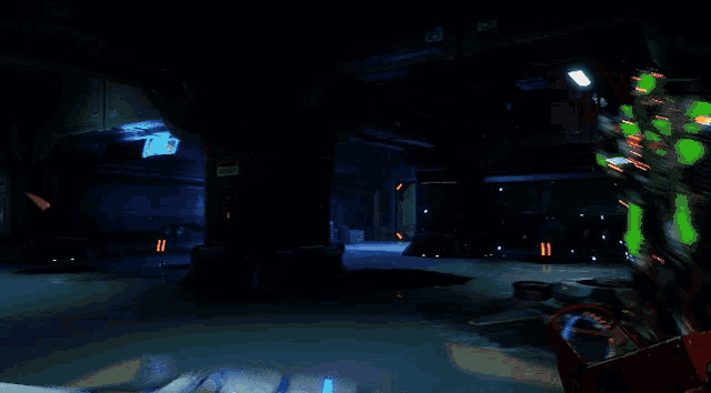 a person holding a gun in a dark room with a light coming out of the corner