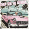 a man is driving a pink car on a beach with palm trees in the background .