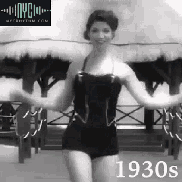 a woman in a black bathing suit is dancing in a black and white photo from the 1930s .