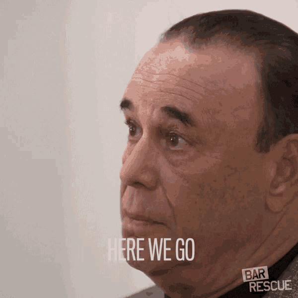 a man says here we go in front of a bar rescue sign