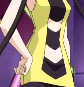 a close up of a woman 's torso in a yellow and black dress .