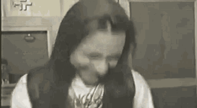 a black and white photo of a person in a room .