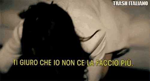 a blurred image of a person laying down with the words trash italiano above