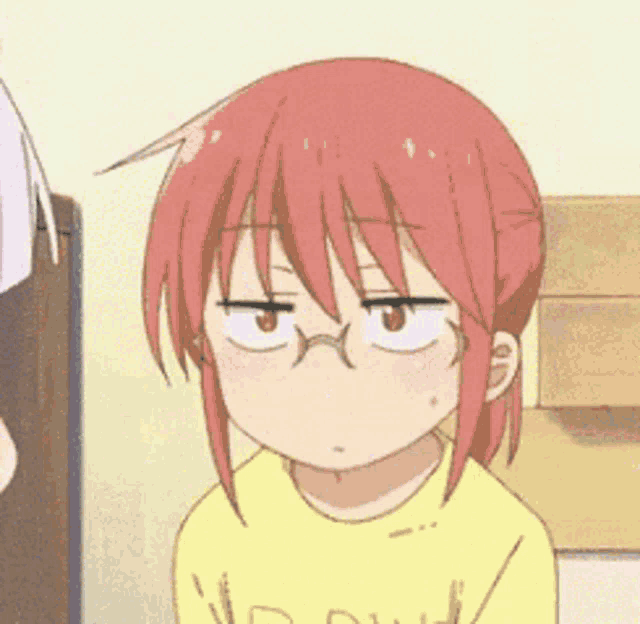a cartoon girl with red hair and glasses is wearing a yellow shirt and making a funny face .