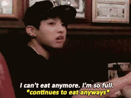 a man in a baseball cap says i can 't eat anymore i 'm so full and continues to eat anyways