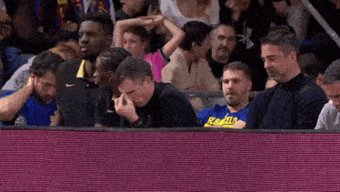 a man wearing a blue shirt that says fc barcelona
