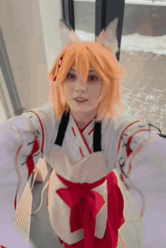 a girl in a fox costume taking a selfie