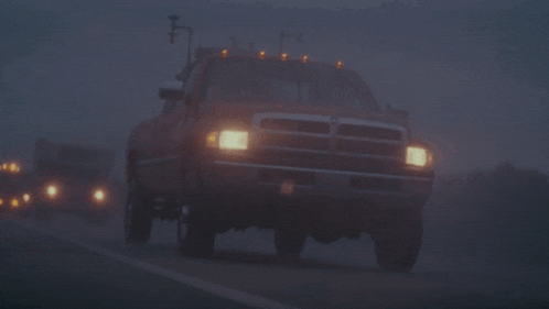 a dodge ram truck is parked in the fog