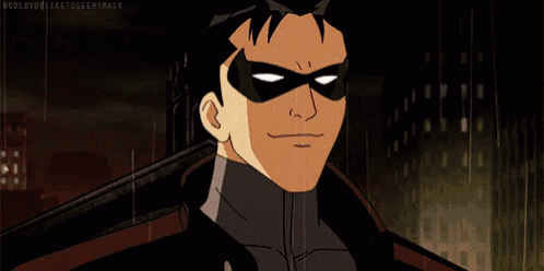 a cartoon character with a mask on his face is standing on a rooftop .