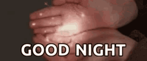 a person is holding a light in their hands with the words `` good night '' written above them .