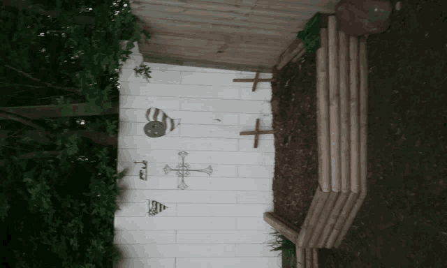 a white wall with a few drawings on it including one that says " i love you "