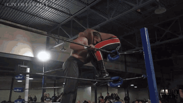 two men in a wrestling ring with #gpcollective on the bottom right