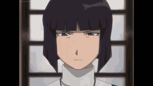 a girl with short black hair and a white turtleneck looks at the camera with a serious look on her face
