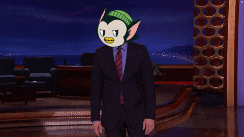 a man in a suit has a cartoon character on his face and the words " this guy " above him