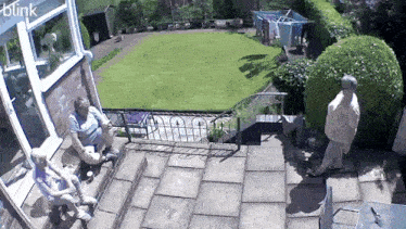 a blink camera shows people sitting on a patio