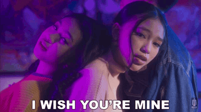 a couple of girls standing next to each other with the words i wish you 're mine