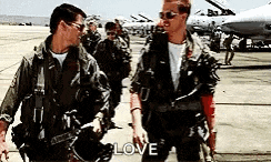 a group of military men are walking on a runway .